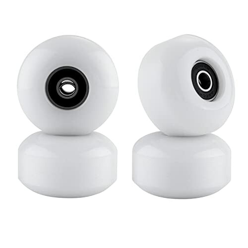 Four white skateboard wheels with bearings